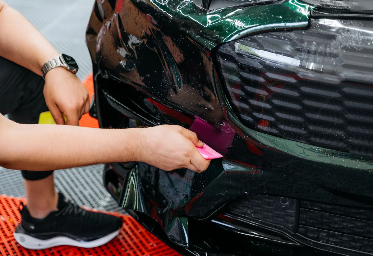 STEK PPF being installed on Ford Mustang Mach-E front bumper at Hussle Customz Los Angeles