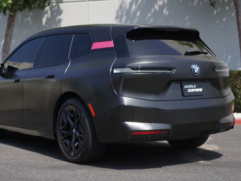 BMW iX Diamond Black Vinyl Wrap — photo 2 — Hussle Customz Los Angeles