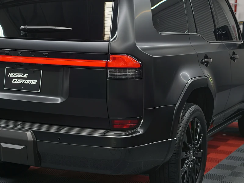 Lexus GX550 with gloss black wheels and painted calipers — rear quarter view by Hussle Customz Los Angeles