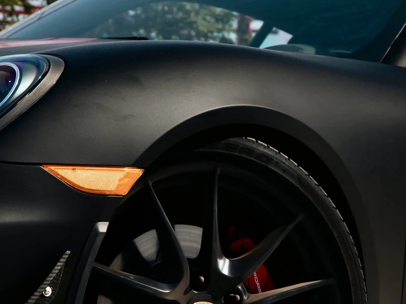 Porsche Cayman Matte Black and Satin Red Stripes — photo 2 — Hussle Customz Los Angeles