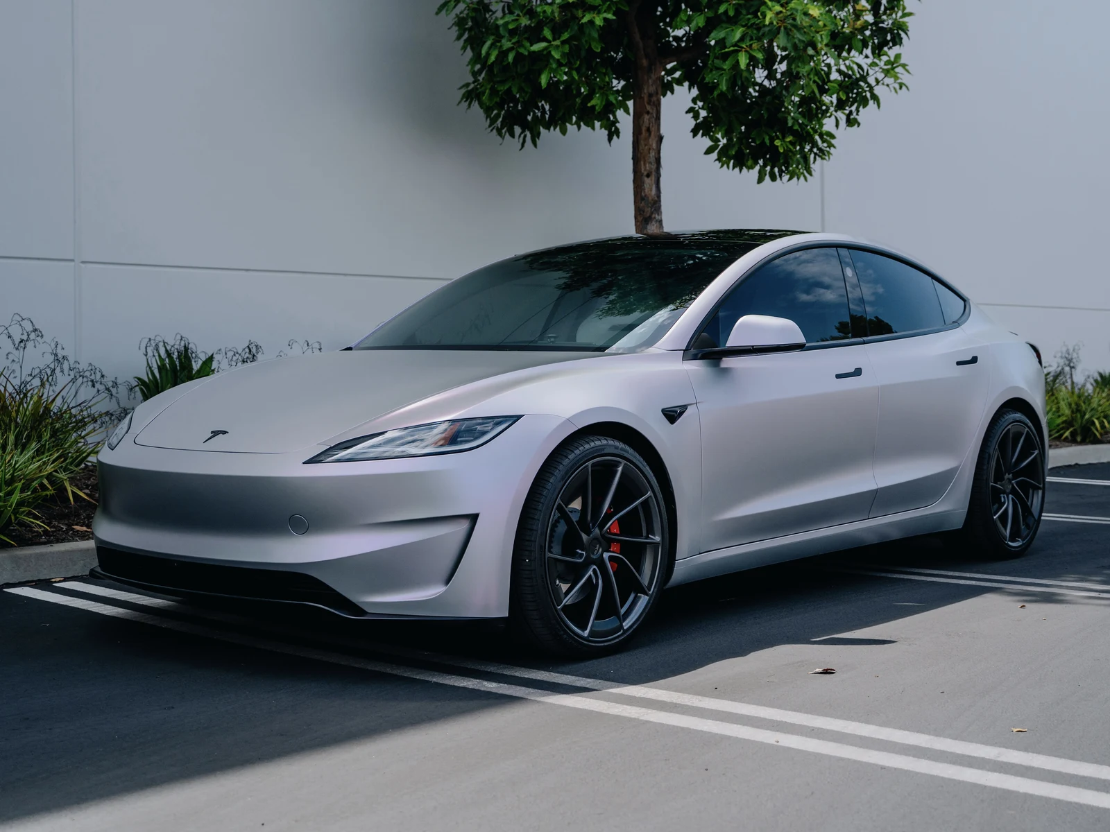 Tesla Model 3 Highland Platinum Pink Vinyl Wrap — photo 1 — Hussle Customz Los Angeles