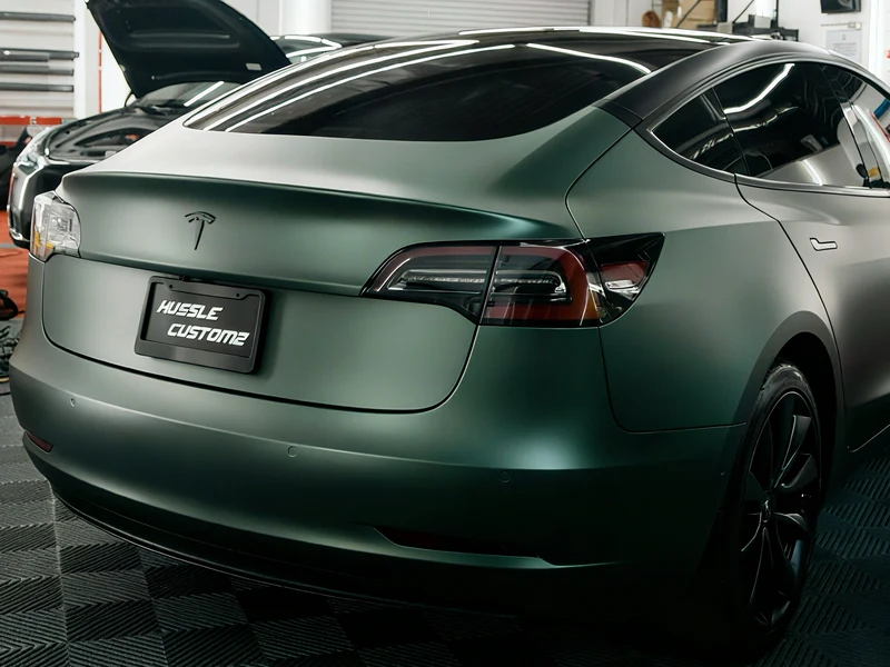Tesla Model 3 Matte Pine Green Metallic Vinyl Wrap — photo 2 — Hussle Customz Los Angeles
