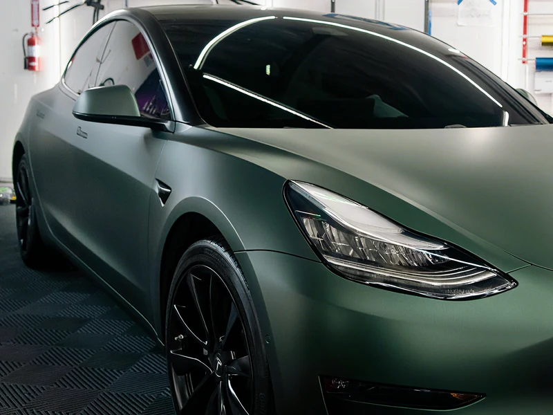 Tesla Model 3 Matte Pine Green Metallic Vinyl Wrap — photo 3 — Hussle Customz Los Angeles