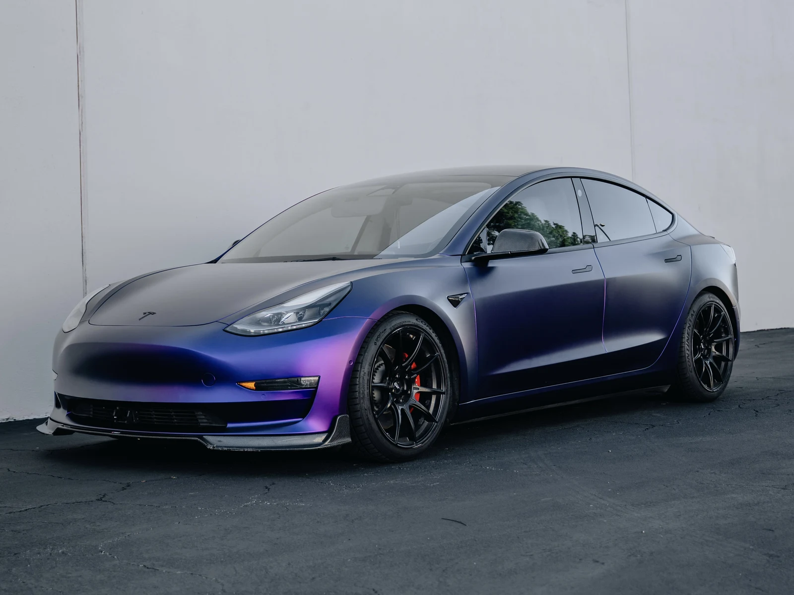 Tesla Model 3 Matte Purple Black Iridescent Wrap — photo 1 — Hussle Customz Los Angeles